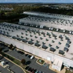 Aerial view of a large energy data center supporting AI driven power grid research and infrastructure.
