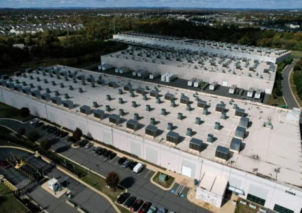 Aerial view of a large energy data center supporting AI driven power grid research and infrastructure.