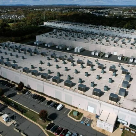Aerial view of a large energy data center supporting AI driven power grid research and infrastructure.