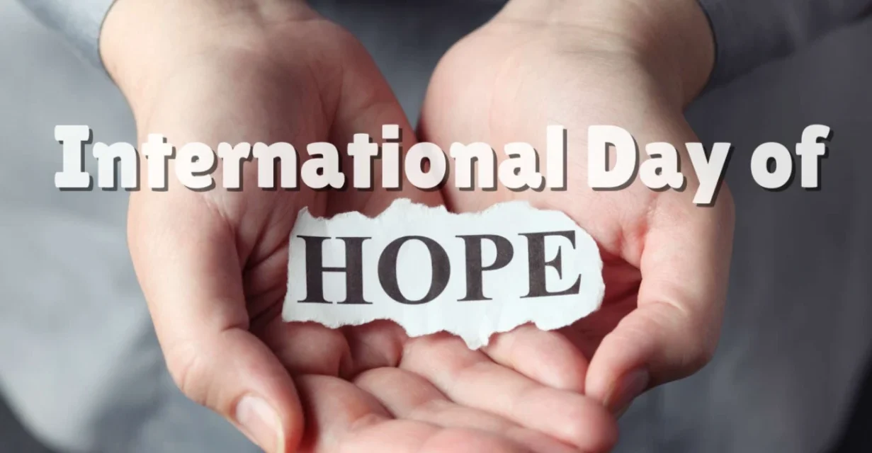 Hands gently holding a paper reading Hope, symbolizing the United Nations International Day of Hope.