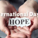 Hands gently holding a paper reading Hope, symbolizing the United Nations International Day of Hope.