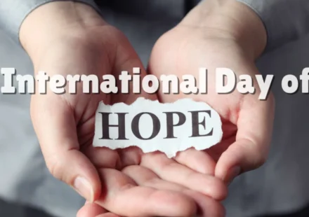 Hands gently holding a paper reading Hope, symbolizing the United Nations International Day of Hope.