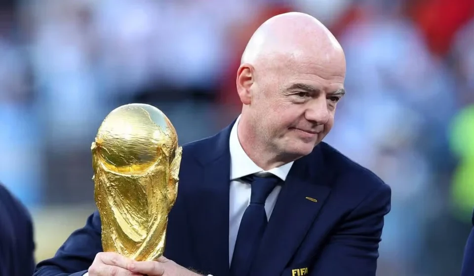 Palestine Football Association Demands FIFA Action; Wales Drops Infantino Support Gianni Infantino holds the FIFA World Cup trophy during a football ceremony. Before the crowd nearby
