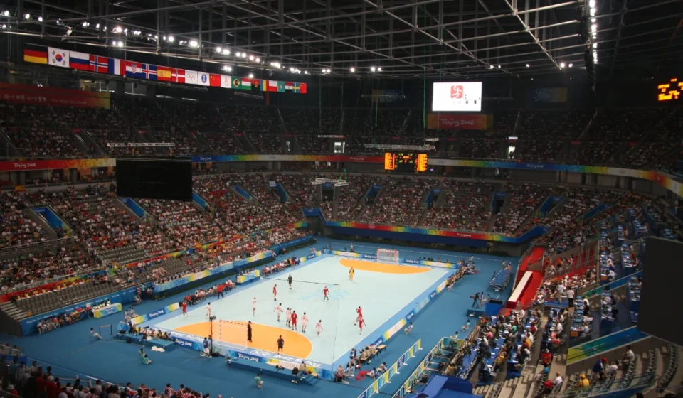 17th Beijing Sports Games Opens at National Indoor Stadium Crowded National Indoor Stadium hosts a handball match with athletes competing before a large crowd.