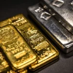 Gold and silver bullion bars stacked together, reflecting demand for precious metals in markets now.