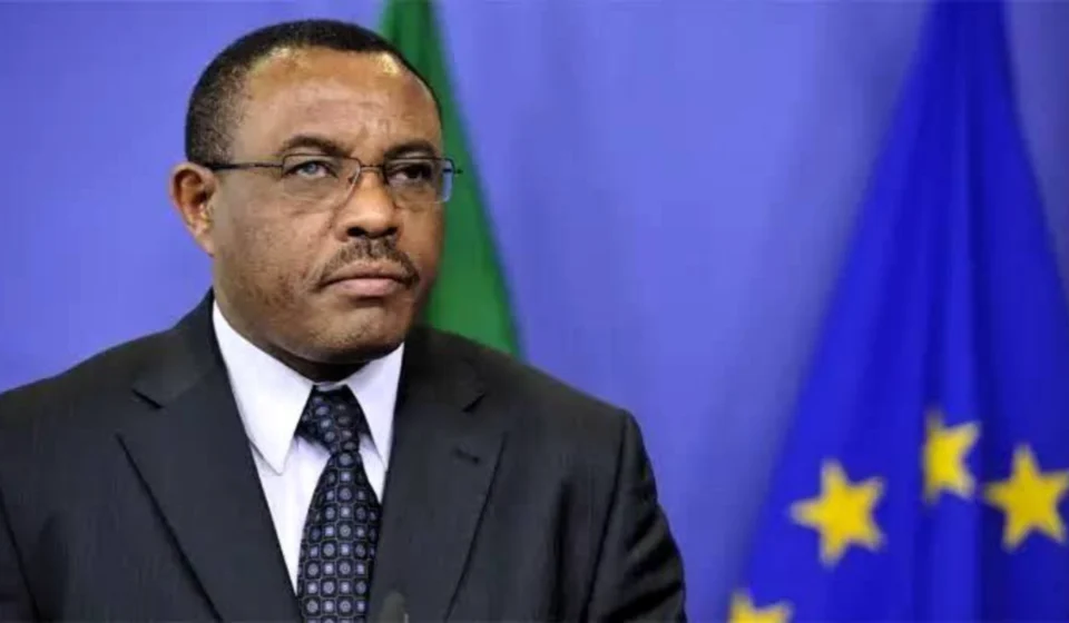 Hailemariam Dessalegn Boshe speaks before Ethiopian and European Union flags during an official address.