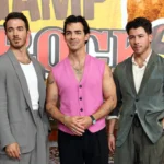 Jonas Brothers pose together at a Camp Rock 3 promotional event, marking their franchise reunion today.