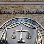 Federal Trade Commission seal displayed outside FTC headquarters building in Washington, DC entrance sign.