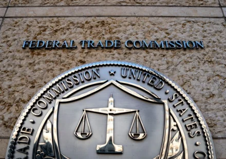 Federal Trade Commission seal displayed outside FTC headquarters building in Washington, DC entrance sign.