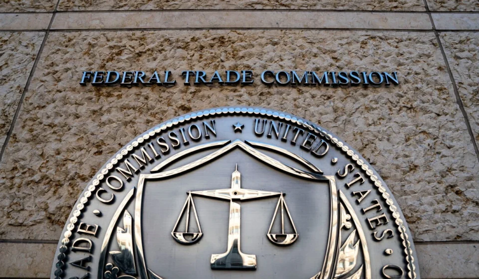 Federal Trade Commission seal displayed outside FTC headquarters building in Washington, DC entrance sign.