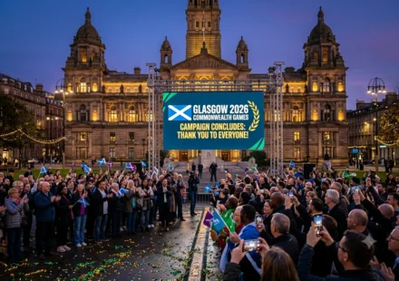 Crowd celebrates Glasgow 2026 Commonwealth Games campaign conclusion in George Square at dusk. Joy!!