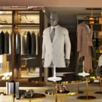 Luxury fashion boutique showcasing tailored suits, elegant apparel, shoes, and premium lifestyle displays.