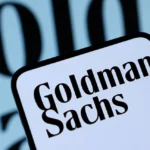 Goldman Sachs logo on a smartphone screen with blurred branded background in close view today now.!!