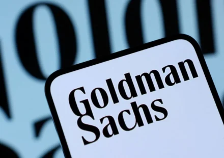 Goldman Sachs logo on a smartphone screen with blurred branded background in close view today now.!!