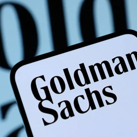 Goldman Sachs logo on a smartphone screen with blurred branded background in close view today now.!!