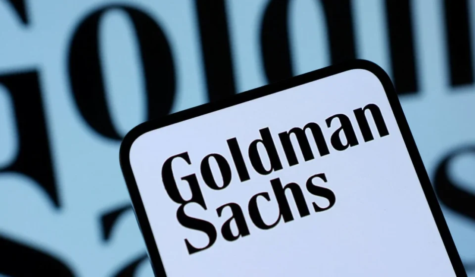 Goldman Sachs Highlights Asian Wealth Shift Away from Real Estate Goldman Sachs logo on a smartphone screen with blurred branded background in close view today now.!!