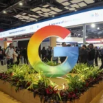 Google AI summit booth showcasing Google logo and education technology innovation exhibition floor.