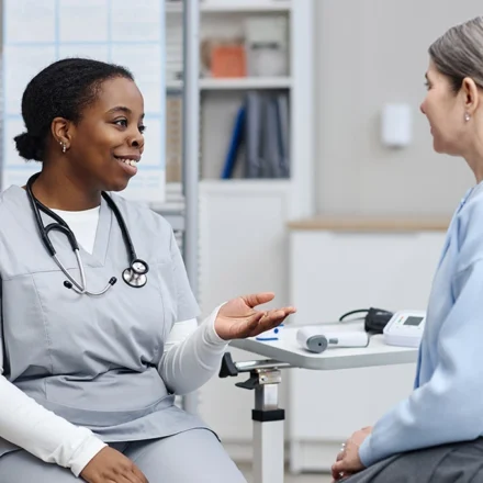 Healthcare provider discusses perimenopause symptoms with patient during a clinic consultation. care
