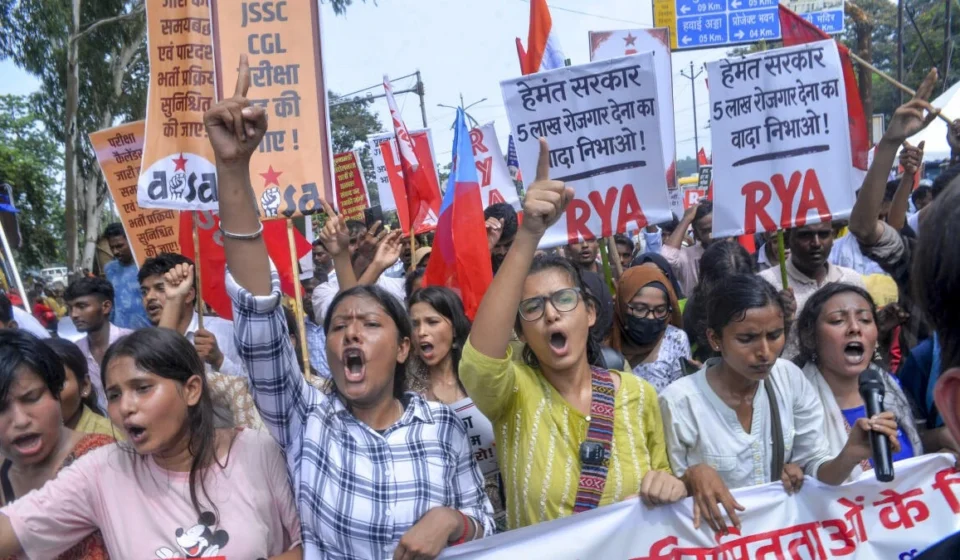 Jharkhand Government Cancels Civil Service Examinations After Student Protests Jharkhand students protest with banners and raised fists during a civil service exam protest rally today