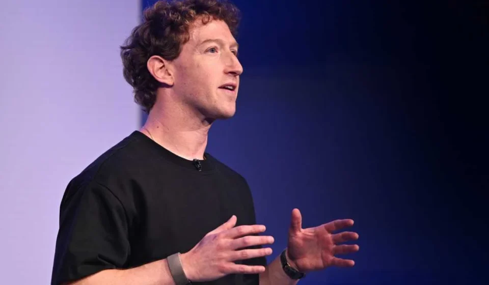 Meta Faces Landmark Youth Addiction Trial in U.S. Federal Court Meta executive speaking onstage in a black shirt, gesturing with both hands against a dark backdrop.