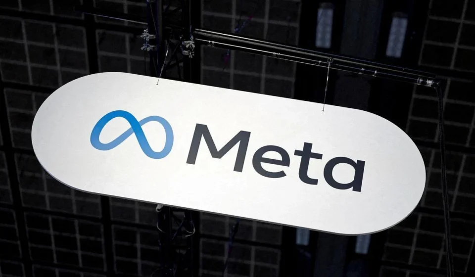 Meta Faces Legal Safe-Harbor Ultimatum Over Platform Moderation Issues Meta company logo displayed on a suspended sign during a technology event inside an exhibition hall.