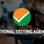 National Testing Agency logo over students taking a computer based entrance examination in India now