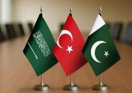 Saudi Arabia, Türkiye and Pakistan flags on a table, symbolizing the newly signed defense agreement.