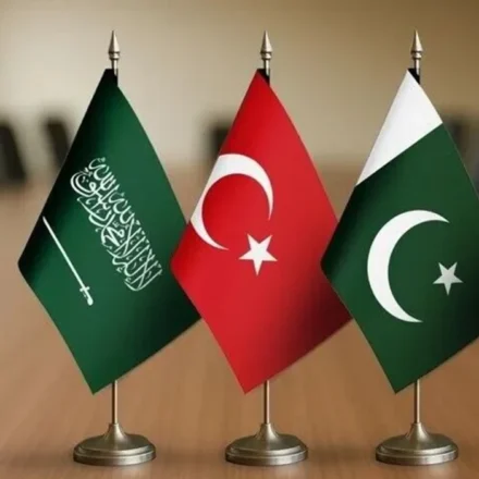 Saudi Arabia, Türkiye and Pakistan flags on a table, symbolizing the newly signed defense agreement.