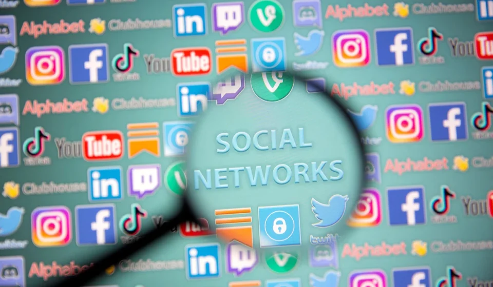 U.S. Appeals Court Permits Youth Social Media Harm Lawsuits Magnifying glass over social media icons, highlighting concerns about youth online safety and harms.
