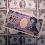 Japanese 1,000 yen banknote displayed over U.S. dollar bills, illustrating foreign exchange markets and trade.