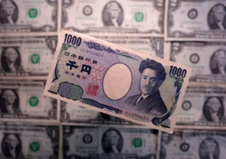 Japanese 1,000 yen banknote displayed over U.S. dollar bills, illustrating foreign exchange markets and trade.