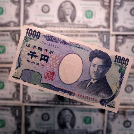 Japanese 1,000 yen banknote displayed over U.S. dollar bills, illustrating foreign exchange markets and trade.