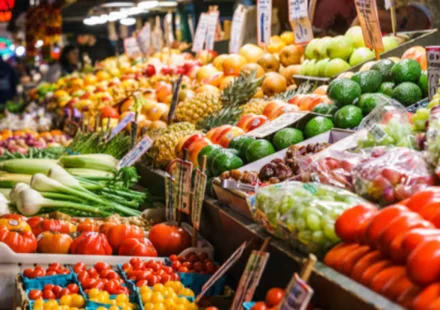 Fresh produce fills a busy market stall as global food commodity prices hit three year high this July