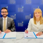 WTTC and World Governments Summit representatives sign a global travel partnership at a formal event