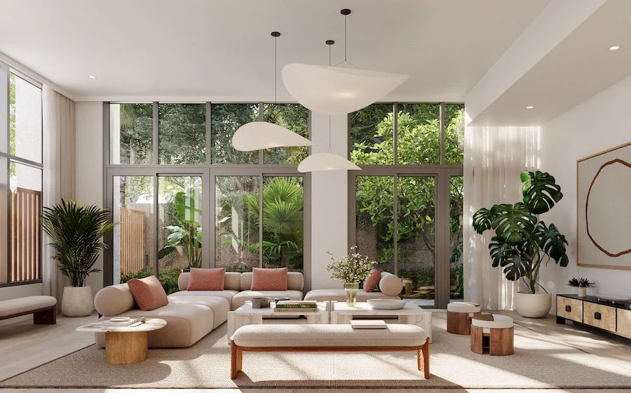 Bright wellness inspired living room with floor to ceiling windows, indoor plants, natural light.
